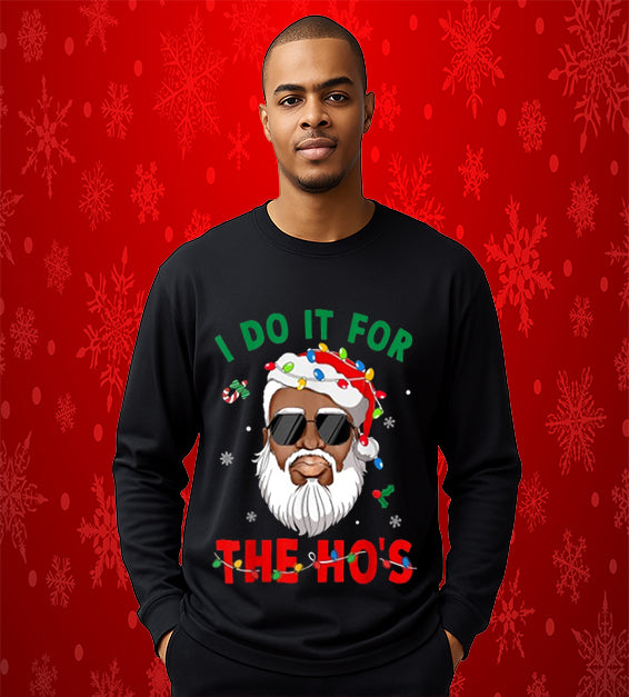 “Funny Black Santa Christmas sweatshirt with sunglasses, Santa hat wrapped in colorful lights, and festive red and green text reading ‘I Do It For The Ho’s.’”