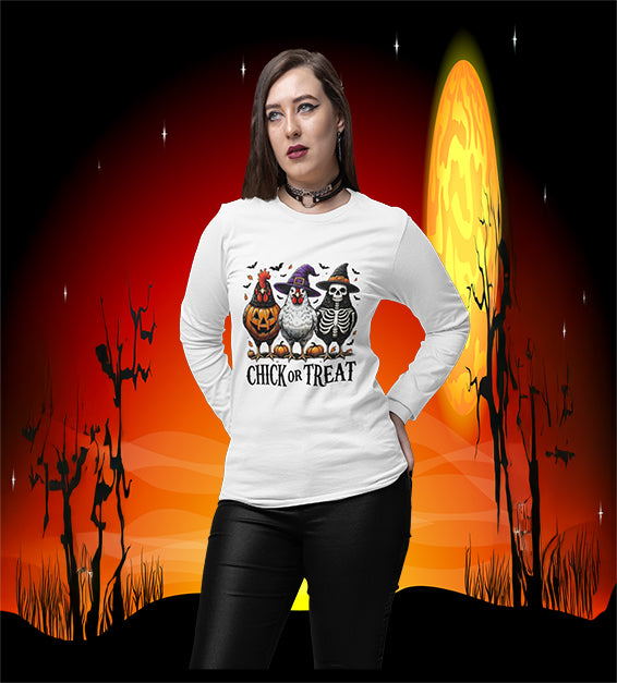 Woman wearing white Chick or Treat Halloween shirt with chickens dressed as pumpkin, witch, and skeleton
