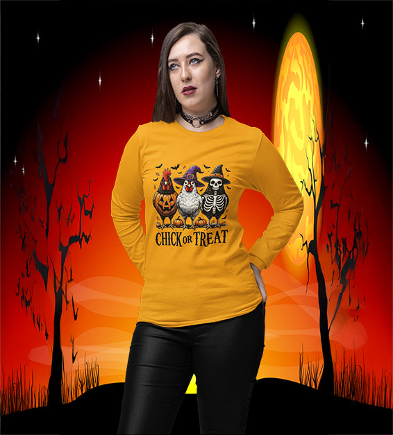 Woman wearing Gold Chick or Treat Halloween shirt with chickens dressed as pumpkin, witch, and skeleton