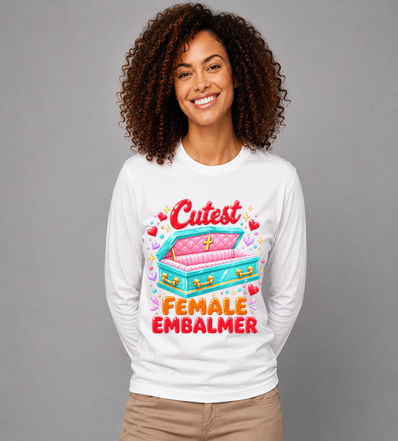 woman wearing white long sleeve t shirt featuring colorful cutest female embalmer graphic with decorative casket design