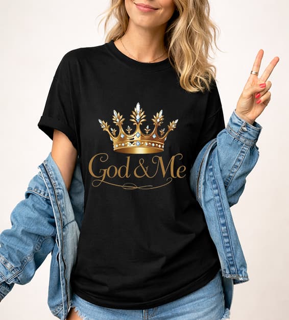 Young woman wearing black God and Me crown graphic t-shirt with gold design, faith-based Christian apparel,