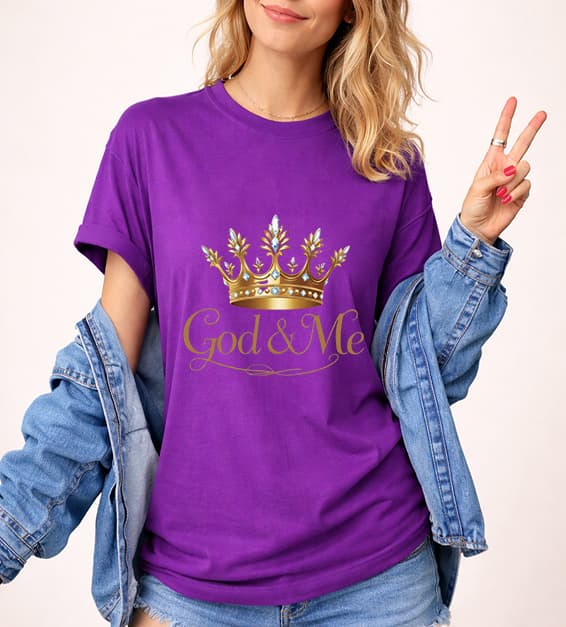 Young woman wearing team purple God and Me crown graphic t-shirt with gold design, faith-based Christian apparel