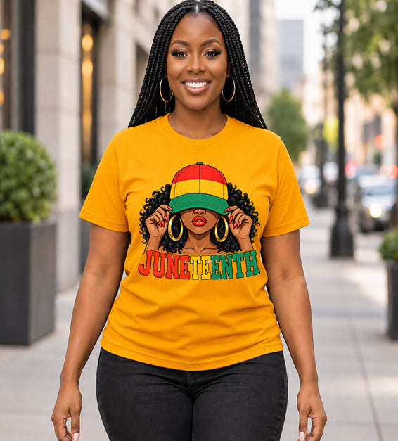 Gold Juneteenth graphic T-shirt featuring illustrated woman in red, yellow and green cap worn by female
