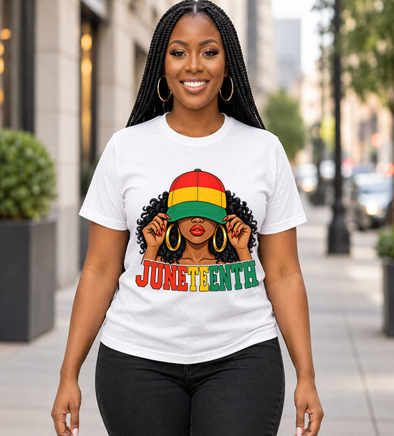 White Juneteenth graphic T-shirt featuring illustrated woman in red, yellow and green cap worn by female