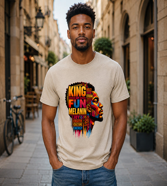 King of Fun Melanin short sleeve Bella + Canvas shirt featuring colorful Afrocentric male portrait artwork and inspirational typography on a sand dune shirt.