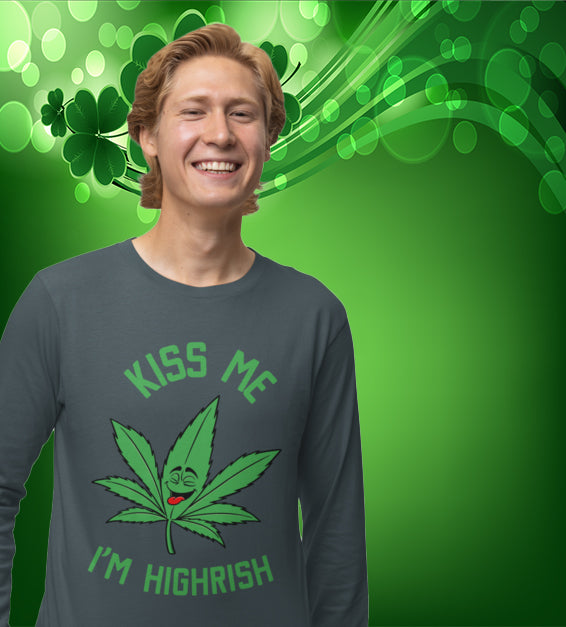  unisex t-shirt featuring a playful green cannabis leaf with a funny face, tongue out, and the words "Kiss Me I’m Highrish" in bold, festive lettering.
