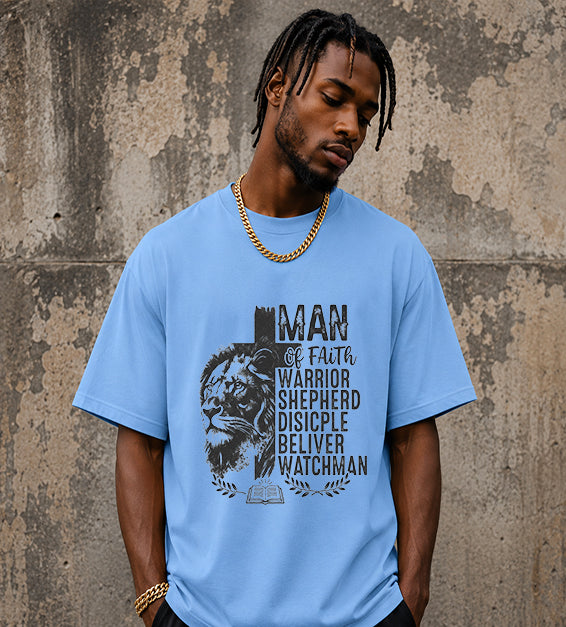 Christian men's t-shirt featuring Lion of Judah artwork with Man of Faith typography including Warrior, Shepherd, Disciple, Believer, and Watchman on a carolina blue colored shirt.