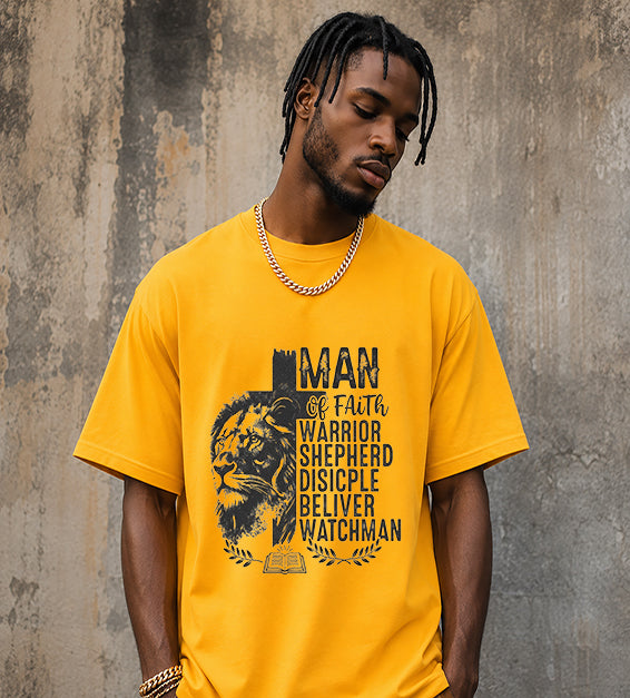 Christian men's t-shirt featuring Lion of Judah artwork with Man of Faith typography including Warrior, Shepherd, Disciple, Believer, and Watchman on a gold colored shirt.