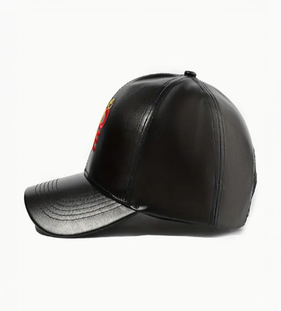 Black faux leather baseball cap with embroidered “One Love” in red, yellow, and green Rasta colors.