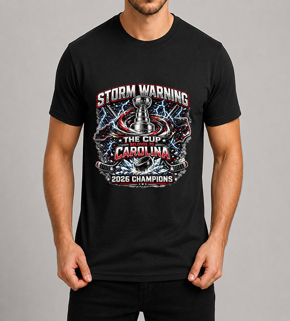 Black hockey fan t-shirt featuring championship-inspired trophy artwork with storm graphics, shattered ice, hockey puck, and bold athletic typography celebrating a championship season.