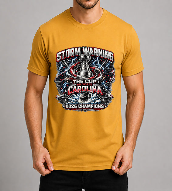 Mustard hockey fan t-shirt featuring championship-inspired trophy artwork with storm graphics, shattered ice, hockey puck, and bold athletic typography celebrating a championship season.