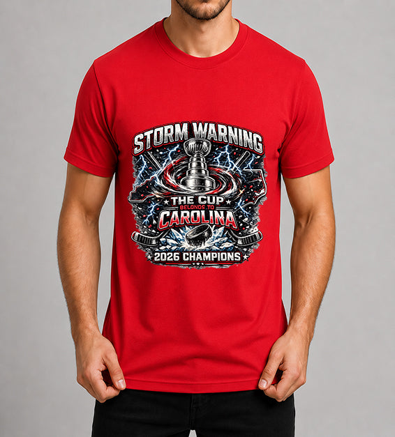 Red hockey fan t-shirt featuring championship-inspired trophy artwork with storm graphics, shattered ice, hockey puck, and bold athletic typography celebrating a championship season.