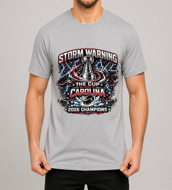 Thyme hockey fan t-shirt featuring championship-inspired trophy artwork with storm graphics, shattered ice, hockey puck, and bold athletic typography celebrating a championship season.