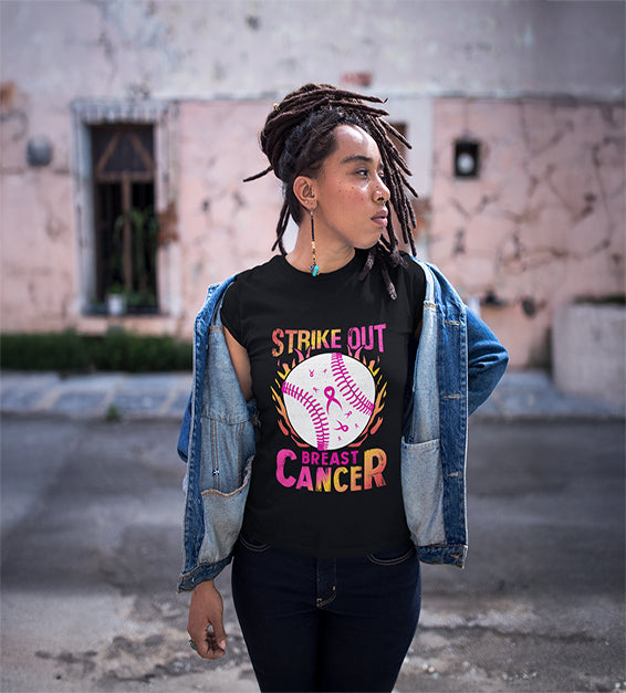 Black woman wearing a black t-shirt with a pink softball and “Strike Out” text – awareness graphic shirt
