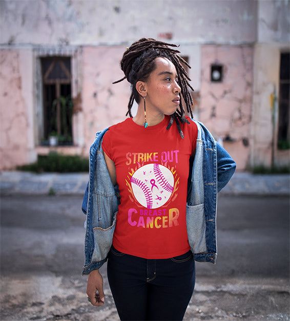 Black woman wearing a red t-shirt with a pink softball and “Strike Out” text – awareness graphic shirt