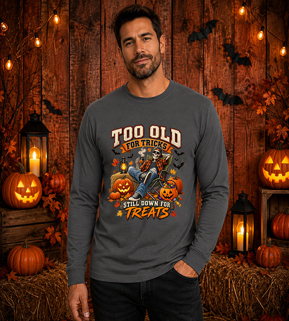 Man wearing asphalt Too Old for Tricks Still Down for Treats Halloween long sleeve shirt with skeleton and pumpkin graphic