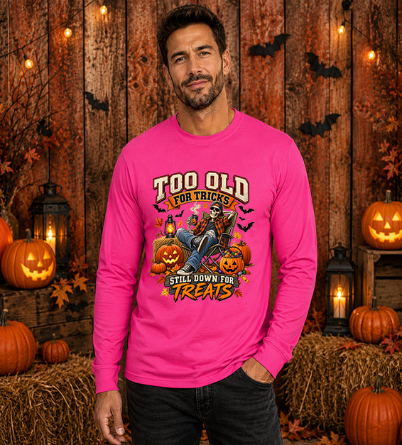 Man wearing Berry Too Old for Tricks Still Down for Treats Halloween long sleeve shirt with skeleton and pumpkin graphic