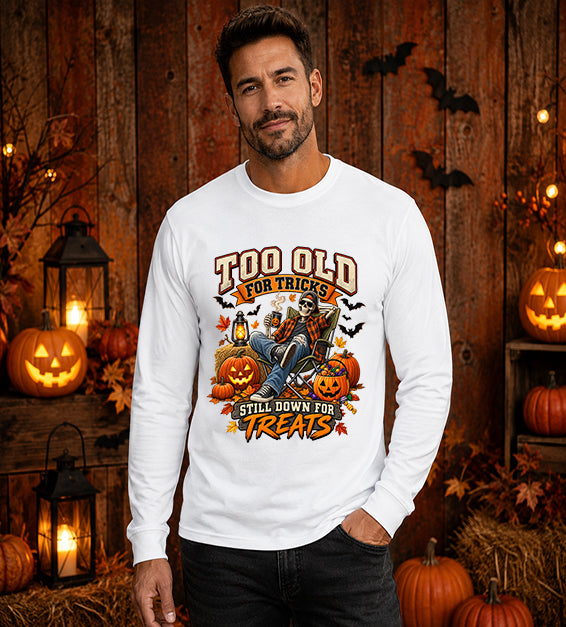 Man wearing White Too Old for Tricks Still Down for Treats Halloween long sleeve shirt with skeleton and pumpkin graphic